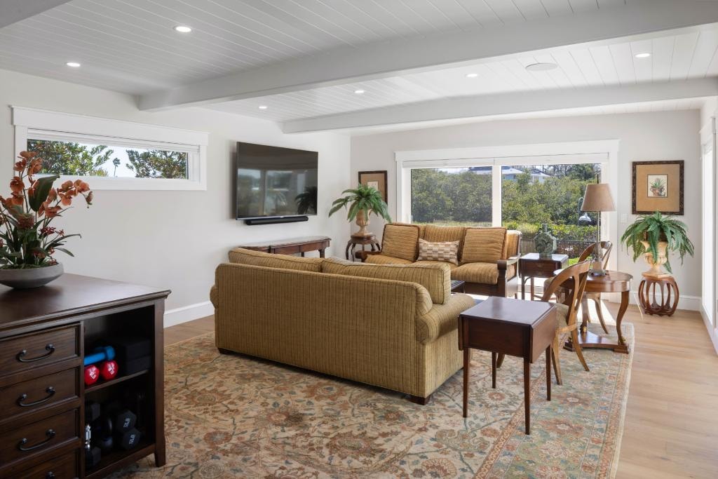 Renovated living room with shiplap ceiling and natural light